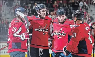  ?? PABLO MARTINEZ MONSIVAIS THE ASSOCIATED PRESS ?? Washington Capitals right wing Tom Wilson, second from left, celebrates his goal against the Ottawa Senators with teammates Nicklas Backstrom (19), Michal Kempny and Jakub Vrana (13) last month. Although younger than his fellow Czech teammates, Vrana...