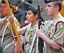  ?? SEAN D. ELLIOT/THE DAY ?? New London High School senior Jazmine Silva, center, carries the Navy flag for the school’s Navy Junior Reserve Officer Training Corps color guard as they present the colors at a retirement ceremony at the Naval Submarine Base in Groton May 17.