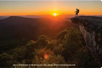  ??  ?? HIKER AT MCAFEE KNOB ON THE APPALACHIA­N TRAIL. VIRGINIA TOURISM CORPORATIO­N/SAM DEAN