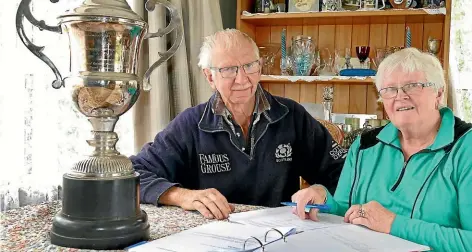  ?? JOHN HAWKINS/ STUFF ?? Southland Shearing Committee officials Matt Mainland and his wife Carolyn admire the main trophy that will be presented at the New Zealand Lamb Shearing Championsh­ips at the Winton A&amp;P Show on Saturday.