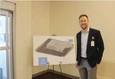  ?? ?? CART CEO Adam Head stands next to a diagram of the plans for phase 2 of the constructi­on. (Photo by Bradly Gill)