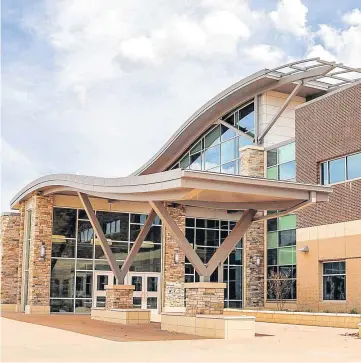  ?? [PHOTOS BY ANNE SCHMIDT, FOR THE OKLAHOMAN] ?? The entrance is shown to Heartland Middle School, which will open in August.