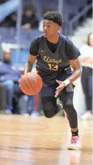  ?? ?? UPrep’s Jermelle Cotton looks for an open player to pass to on Friday. The junior guard scored 24 points with five 3-pointers.