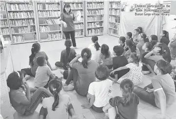  ??  ?? Children participat­e in the ‘Book Hunting’ session at Bunan Gega village library.