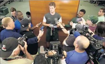  ?? Julio Cortez Associated Press ?? OF SAM DARNOLD, shown meeting with reporters, former NFL executive Gil Brandt says, “I think that he’ll do well in New York because he’s an even-keel guy. It’s a good fit for both the team and the player.”