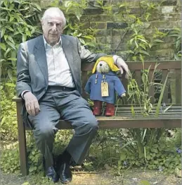  ?? Sang Tan Associated Press ?? ‘A SPECIAL LEGACY’ British author Michael Bond in 2008 with a toy version of Paddington, ursine star of more than 20 books, several TV series, a movie and an upcoming sequel.