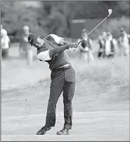  ?? AP/PETER MORRISON ?? Tiger Woods shot a 66 in the third round of the British Open to move within four strokes of the lead heading into today’s final round at Carnoustie, Scotland.