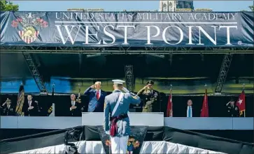  ?? John Minchillo Associated Press ?? PRESIDENT TRUMP’S West Point visit has figured in Lincoln Project’s work (replaying his ramp descent).