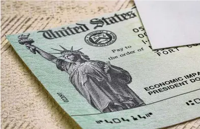  ?? Dreamstime/Tribune News Service ?? The U.S. government issued three rounds of economic stimulus in 2020 and 2021, with checks of $1,200, $600 and $1,400 per adult.