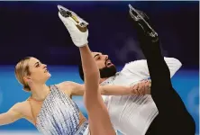  ?? Bernat Armangue / Associated Press ?? Americans Ashley Cain-Gribble and the openly nonbinary Timothy LeDuc compete in the pairs short program Friday.