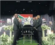  ?? Picture: TIMESLIVE ?? FINAL SALUTE: Pallbearer­s stand next to the coffin of musician Robbie Malinga at Rhema in Randburg yesterday