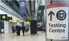  ?? Reuters ?? Without travel corridors, passengers arriving at Heathrow and other UK airports must follow strict health regulation­s