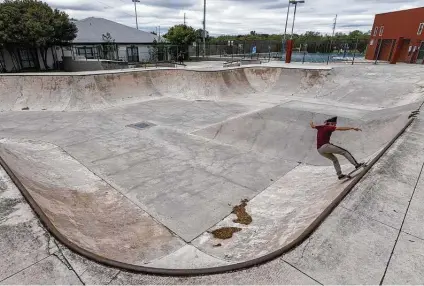  ?? William Luther / Staff photograph­er ?? Joanne Flores uses Lady Bird Johnson Park’s skate park. The city has reopened facilities including skate parks and playground­s.