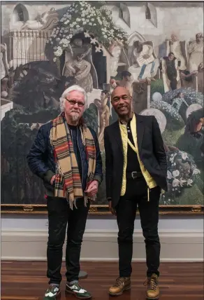 ??  ?? „ Gus Casely-hayford talks to Billy Connolly, in front of Spencer’s The Resurrecti­on, Cookham.