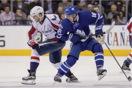  ?? CARLOS OSORIO/TORONTO STAR ?? Right wing Mitch Marner, who took a power play-negating penalty on the play shown above, broke the shutout for the Leafs at the ACC on Tuesday.