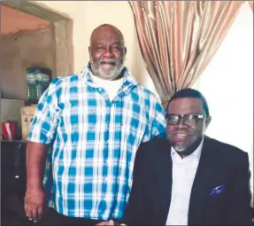  ??  ?? Gentle giant gone to rest… The late Japhet treats the country’s number one citizen, Dr Hage Geingob, to a variety of his tasty homemade delicacies.