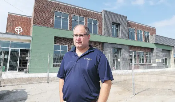  ?? JASON KRYK ?? Tim Brady, pharmacist and owner of Brady’s Drug Store, will open a new medical complex in the former Holy Name elementary school in Essex this fall.