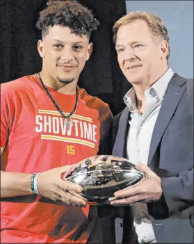  ?? Brynn Anderson
The Associated Press ?? Chiefs QB Patrick Mahomes has twice received the Super Bowl MVP trophy from NFL commission­er Roger Goodell.