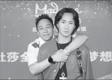  ?? PROVIDED TO CHINA DAILY ?? Beyond’s former bassist, Wong Ka-keung (left) with his brother Wong Ka-kui’s wax replica in Madame Tussauds Beijing.