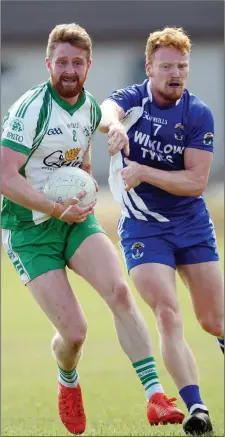  ??  ?? Kevin Murphy of Baltinglas­s is tracked by John Crowe of St Patrick’s during their Senior football championsh­ip match.