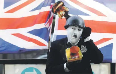  ?? Picture: Reuters ?? NOT HAPPY. An anti-Brexit protester demonstrat­es outside the Houses of Parliament in London on Tuesday.