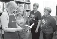  ?? Janelle Jessen/Herald-Leader ?? Friends of the Library volunteers are busy getting ready for their annual Dogwood Festival Book Sale on April 28 through 30. The sale will be held indoors this year in the Siloam Springs Public Library Community Room. Pictured are Friends of the...