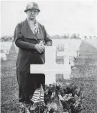 ??  ?? In 1931, Estella Margaret Kendall is photograph­ed at the grave of her son, Harry N. Kendall, located in the MeuseArgon­ne American Cemetery and Memorial in eastern France. First Sgt. Kendall was killed on July 15, 1918.