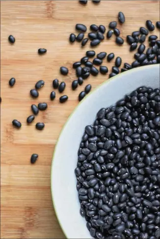  ?? CONTRIBUTE­D BY NELLY RAMIREZ ?? Black beans are an inexpensiv­e ingredient that you can cook from scratch and then use in several dishes throughout the week.