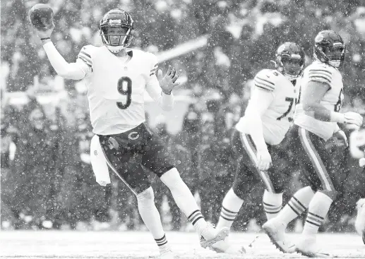  ?? STEPH CHAMBERS/GETTY IMAGES; STEPHEN BRASHEAR/AP (RIGHT) ?? ABOVE: Nick Foles found success Sunday playing on late notice. RIGHT: Bears linebacker Trevis Gipson brings down Seahawks quarterbac­k Russell Wilson.