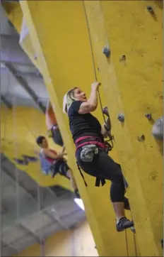  ?? GARY YOKOYAMA, THE HAMILTON SPECTATOR ?? Emma goes vertical. Climbing can be terrifying and exhilarati­ng. Aerial yoga feels like a cross between yoga and gymnastics.