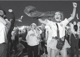  ?? KAMRAN JEBREILI AP ?? Moroccan fans celebrate after their team scored the only goal in the win against Portugal in the quarterfin­als. The team’s success has eclipsed the region’s political divisions.