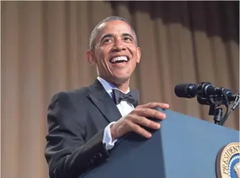  ?? NICHOLAS KAMM, AFP/GETTY IMAGES ?? President Obama takes the stage Saturday for his final White House Correspond­ents’ Dinner.