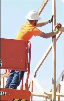  ?? Brodie Johnson • Times-Herald ?? A worker with the Baldwin and Shell Constructi­on Company reinforces a beam in what will be the entrance to the new health center at Central Elementary School in Forrest City.