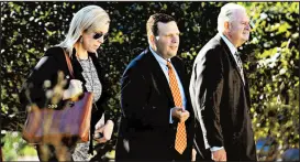  ?? KYLE TELECHAN/POST-TRIBUNE ?? Portage Mayor James Snyder arrives at the federal court in Hammond with his attorneys for a pretrial hearing Sept. 14.