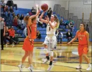  ?? AUSTIN HERTZOG - DIGITAL FIRST MEDIA ?? Spring-Ford’s Lucy Olsen pulls up for a shot and scores over Perkiomen Valley’s Brynne Wacker during the second half Thursday.