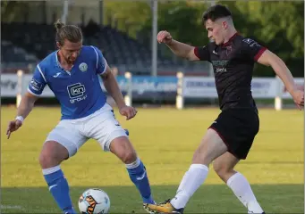  ??  ?? Aaron Dobbs battling w ith Finn Harps defender Keith Cow an on his retu rn to competitiv­e action.