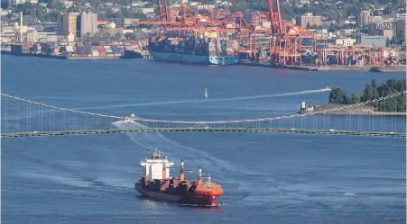  ?? THE CANADIAN PRESS ?? The container ship Ballenita passes under the Lions Gate Bridge after leaving port in Vancouver on Monday. Global trade in raw commoditie­s is likely to decline as the novel coronaviru­s makes it more difficult to move people and goods around the world. It’s a wake-up call for Canada’s resource-based industries, experts say.