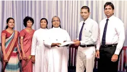  ??  ?? Good Shepherd Convent Principal Rev. Sr. Renuka Silva and Headstart Director Asanga Vitharana exchange the relevant agreements in the presence of representa­tives of the respective institutio­ns