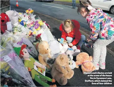  ??  ?? Flowers and tributes are laid at the scene of the housefire in Sycamore Lane, Stafford, which claimed thelives of four children