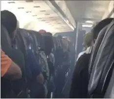  ??  ?? This frame from mobile phone video shows smoke inside an Allegiant Air jet after it landed at Fresno Yosemite Internatio­nal Airport in California’s Central Valley, on Monday. ESTEVAN MORENO VIA AP
