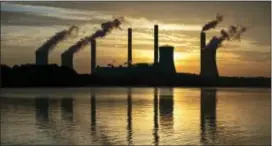  ?? ASSOCIATED PRESS ?? The coal-fired Plant Scherer, one of the nation’s top carbon dioxide emitters, stands in the distance in Juliette, Ga. President Donald Trump’s recent decision to pull the United States from the internatio­nal climate deal reached in Paris was but the...