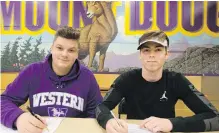  ?? ADRIAN LAM, TIMES COLONIST ?? Phil Grohovac, left, signs with the University of Western Ontario, while Hayden Naylor will head to the University of Alberta.