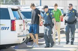  ?? Travis Spradling Advocate ?? LOUISIANA STATE UNIVERSITY students Zachary Hall, left, and Sean Pennison face charges in the hazing death of fraternity pledge Maxwell Gruver.