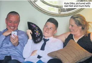  ??  ?? Kyle Dilks, pictured with dad Neil and mum Kelly