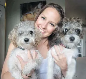  ?? JASON PAYNE/PNG ?? Kasey Pedersen of Rescue Paws with her two local rescue dogs, Moose and Toast, at her North Vancouver home.