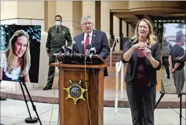  ?? David Middlecamp Associated Press ?? CAL POLY President Jeffrey Armstrong speaks at a news conference Tuesday in San Luis Obispo. At left is a photo of Kristin Smart, who was a freshman in May 1996 when she disappeare­d while returning to her dorm.