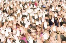  ?? ?? In this file photo taken on July 25, 1997, demonstrat­ors show their hands painted white, during a protest in Ermua against Popular Party (PP) councillor Miguel Angel Blanco’s death, at the hands of ETA.