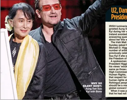  ??  ?? why so silent now?: Aung san suu Kyi with Bono