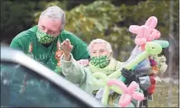  ?? Tyler Sizemore / Hearst Connecticu­t Media ?? A parade celebrates the birthdays of Pat Chrusz and her son-in-law John Zaleski outside Pat’s home in Greenwich on Sunday. Both Pat and John were born and raised in Greenwich and share a birthday on St. Patrick’s Day, when Pat will turn 95 and John, who lives in Stamford, will turn 65.