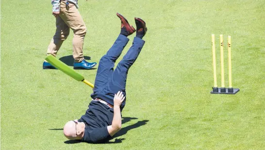  ?? ?? Chris Luxon takes a tumble while playing cricket at last year’s National Party caucus retreat.